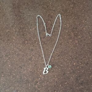 Elegant Silvertone Necklace with Green Heart Gemstone.